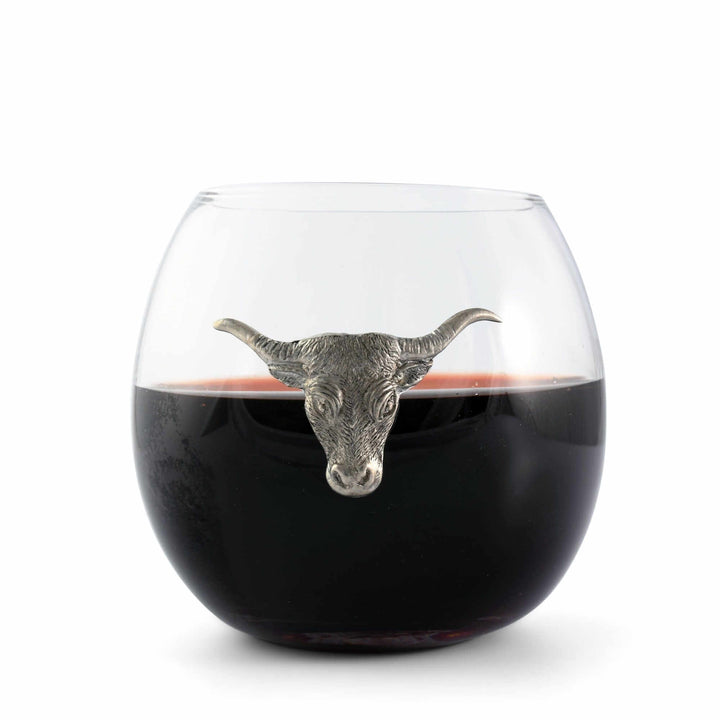 Wine glass with a bull head stopper on a white background