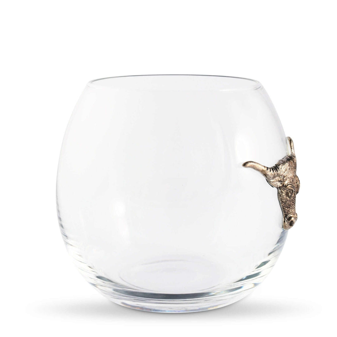 Clear glass tumbler with a pewter bull  on a white background