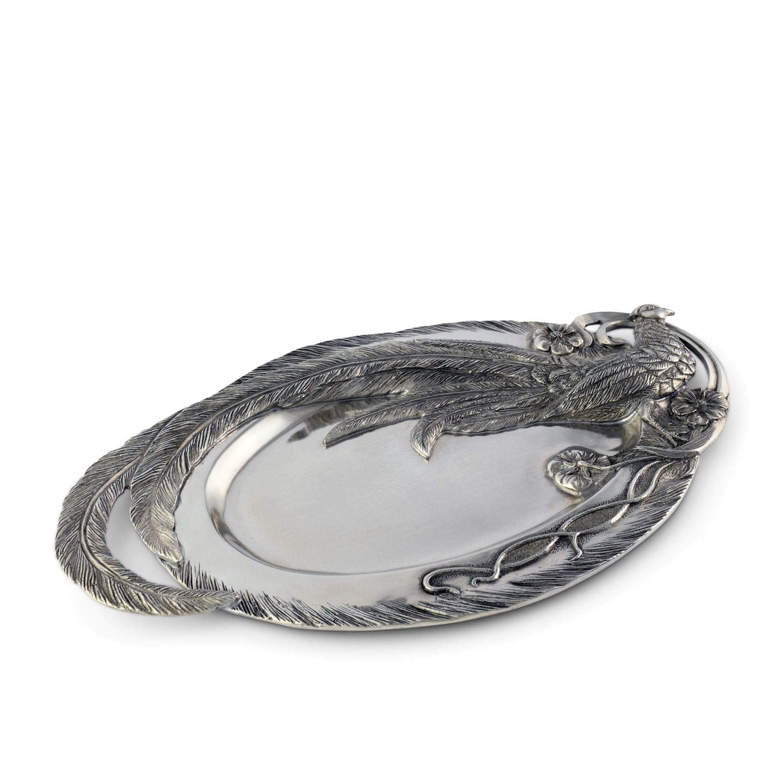 Silver platter with decorative edge on a white background