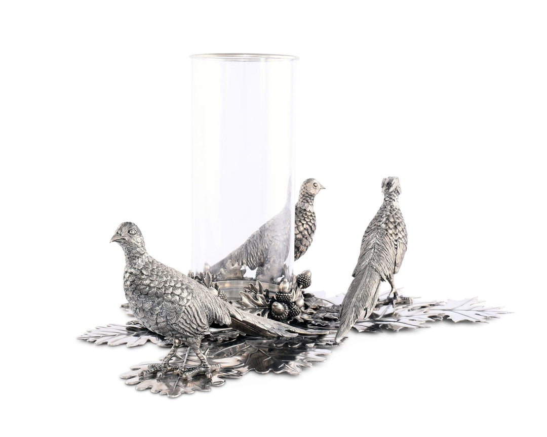 Decorative silver pheasant figurines on a white background