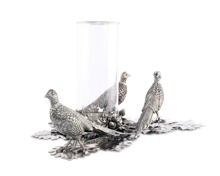Decorative silver pheasant figurines on a white background