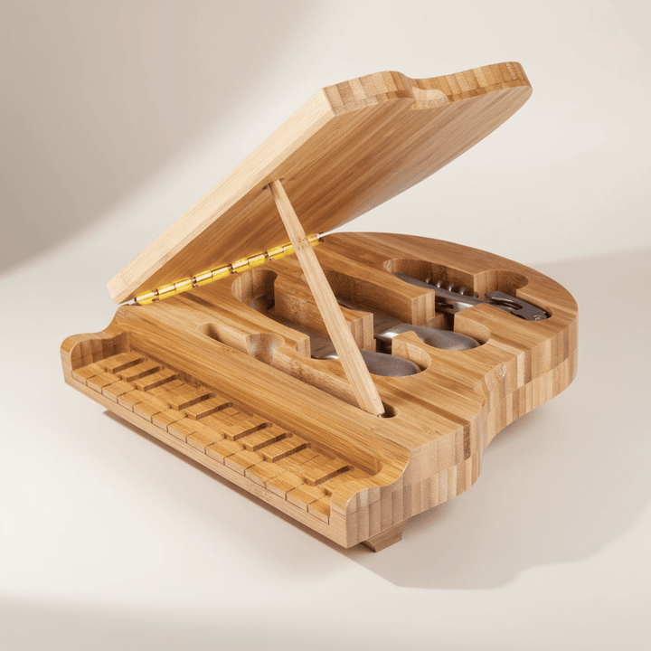 Piano Cheese Board and Knife Set crafted from bamboo, showcasing a split-level design shaped like a grand piano, open and ready for use.