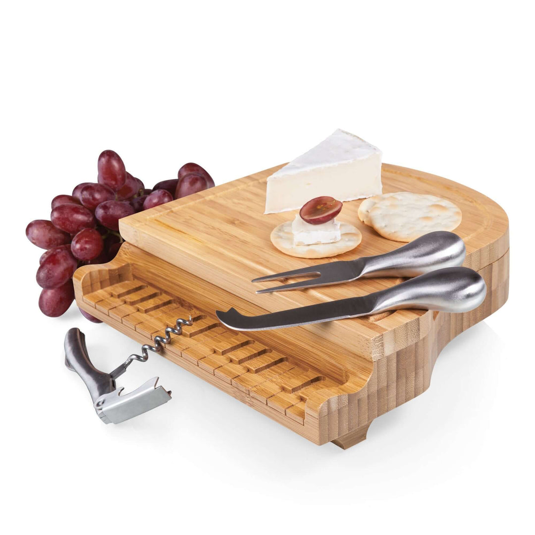 Piano Cheese Board and Knife Set, bamboo board shaped like a grand piano with cheese, crackers, and utensils, perfect for entertaining.
