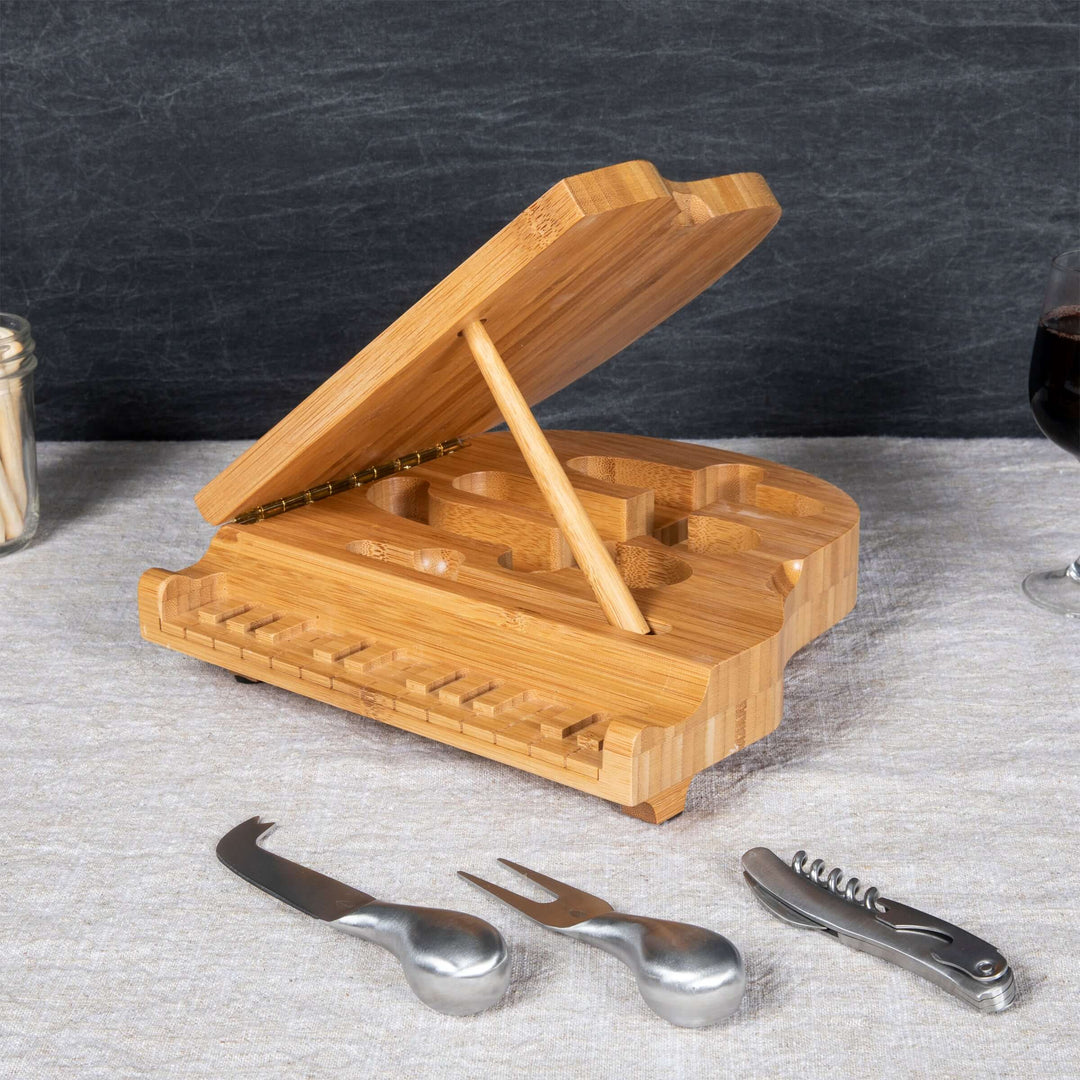 Piano Cheese Board and Knife Set made of bamboo, designed to resemble a grand piano, with included cheese knives and corkscrew.