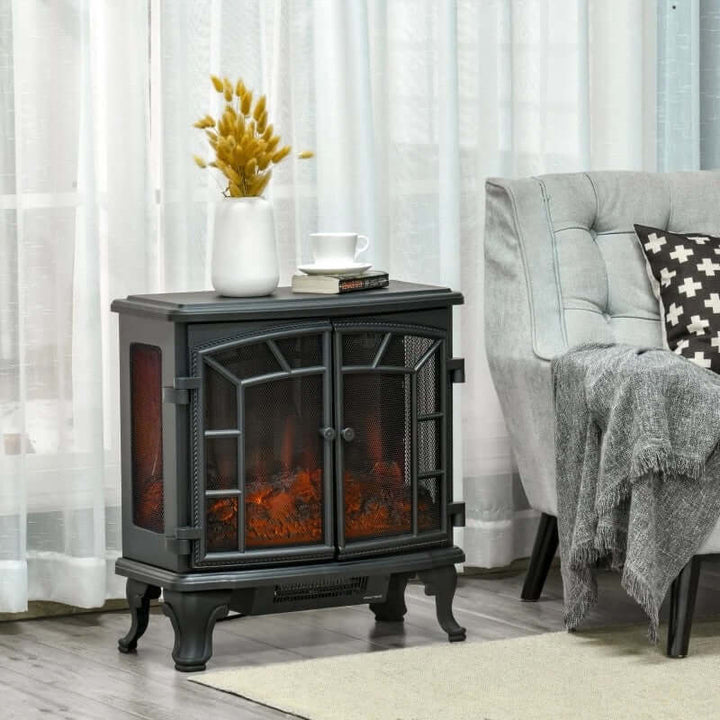 Electric fireplace heater in a living room setting with a chair and decorative items.