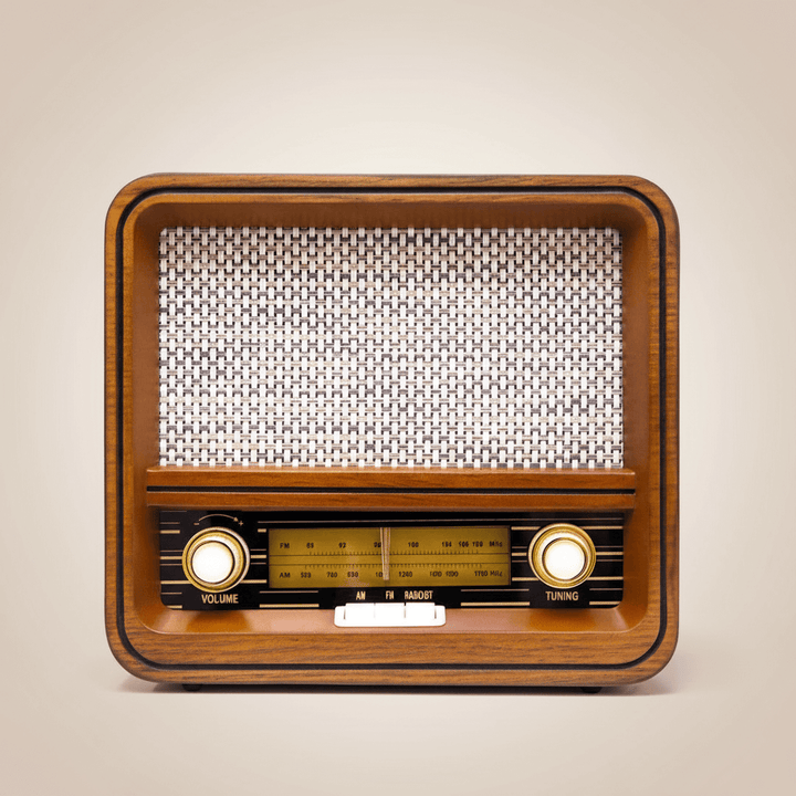 Vintage-style radio with wooden casing on a beige background