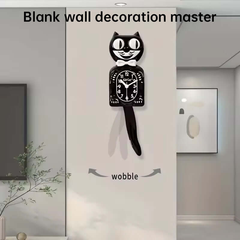 Black cat-shaped wall clock on a white wall with minimal decor.