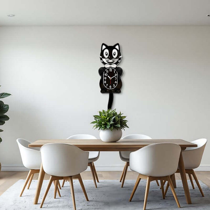Dining room with a wooden table and white chairs, featuring a unique wall clock shaped like a cat.