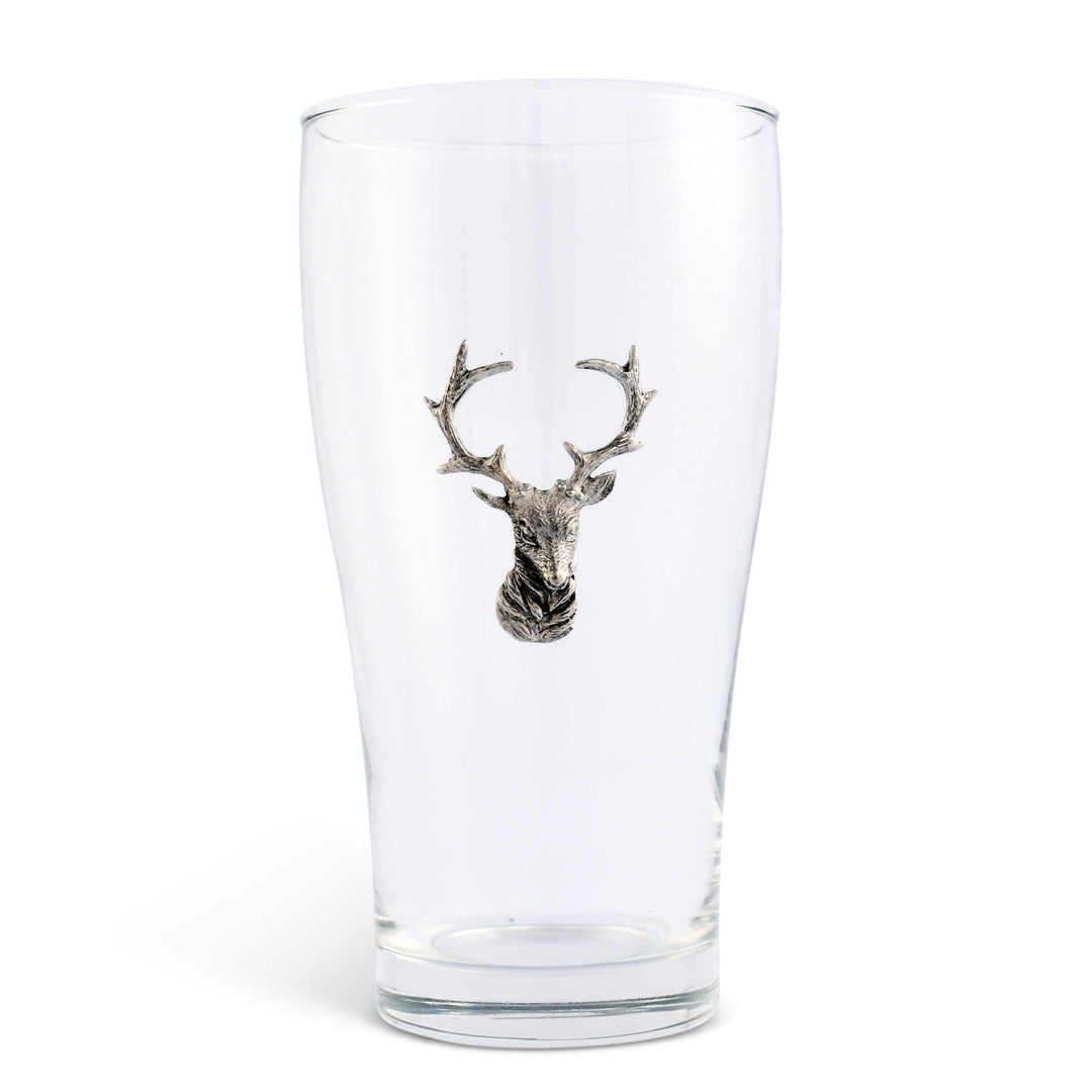 Clear glass with a metallic deer head emblem on a white background