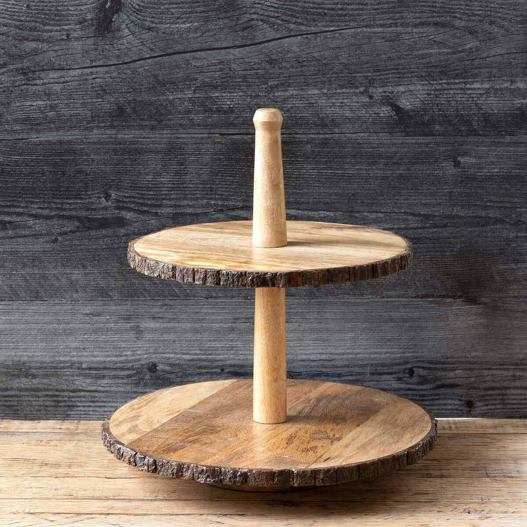 Two-tiered wooden stand with a rustic design against a dark wooden background