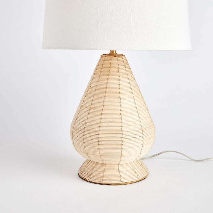 Teardrop Rattan Table Lamp with White Linen Shade with focus on the base