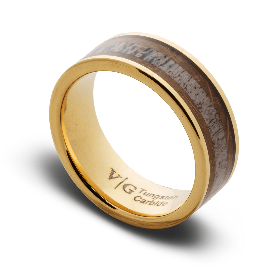 Gold ring with wooden inlay on a white background