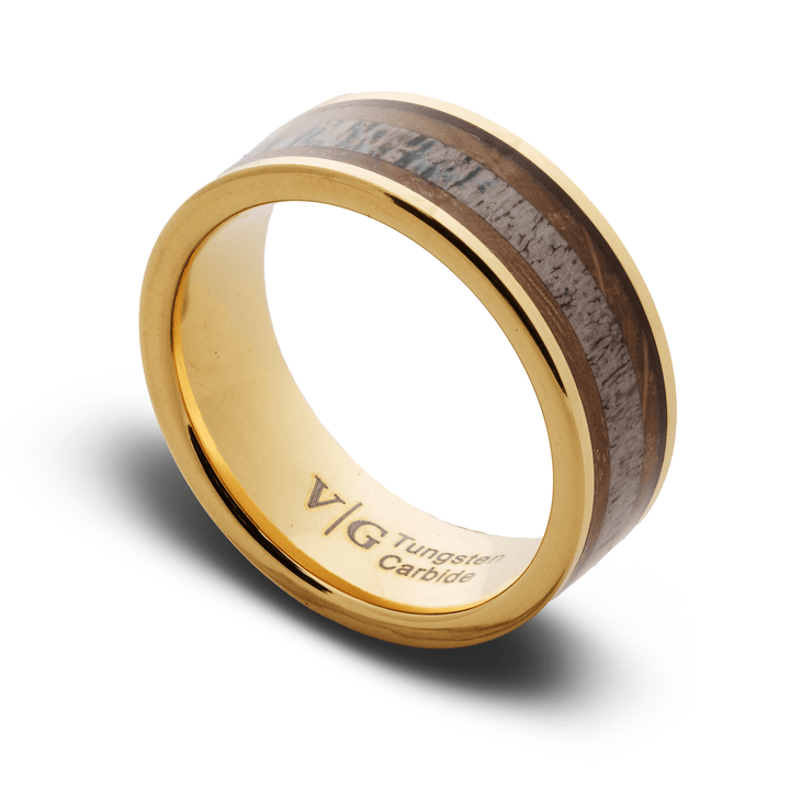 Gold ring with wooden inlay on a white background