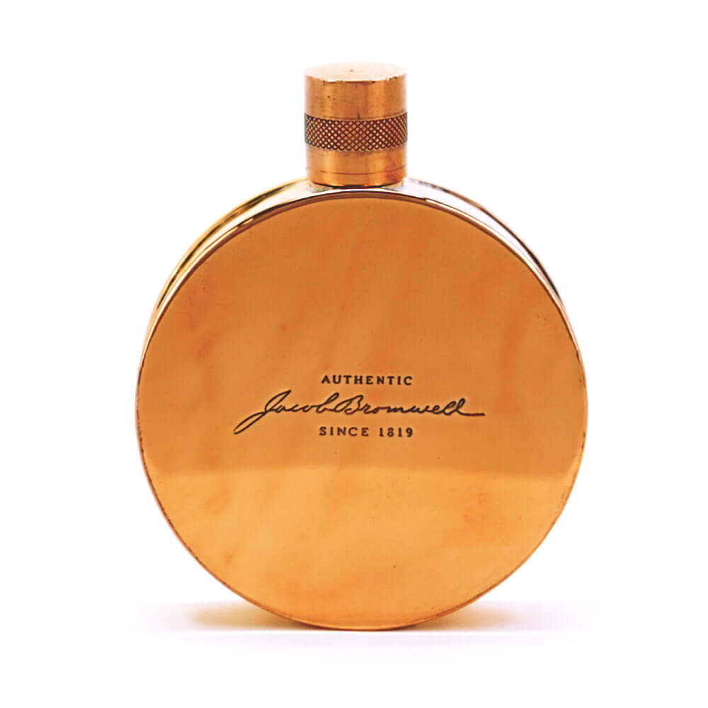 Round copper flask on a white background