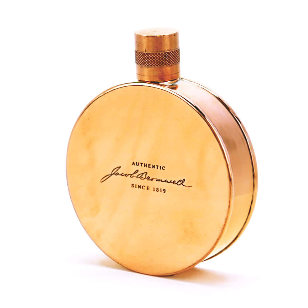 Copper flask with 'Authentic Jacob Bromwell Since 1819' text on a white background