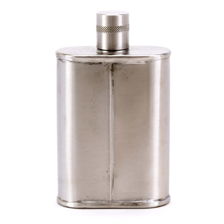 Silver flask with a textured cap on a white background