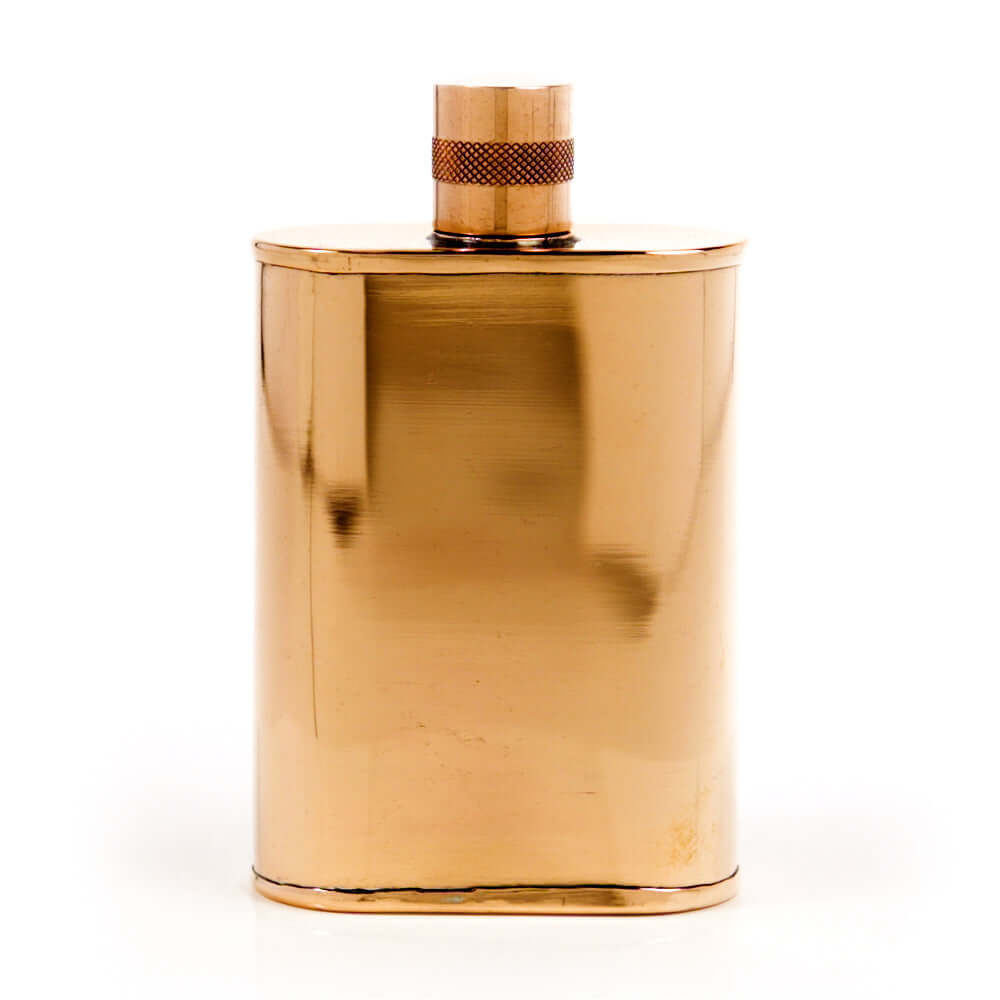 Copper flask with cap on a white background