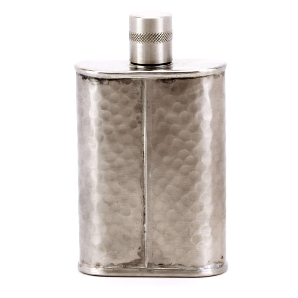 Silver flask with a textured surface on a white background