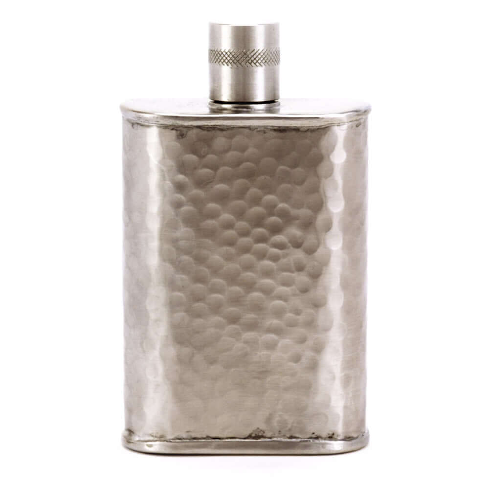 Silver flask with textured surface and metallic cap on a white background
