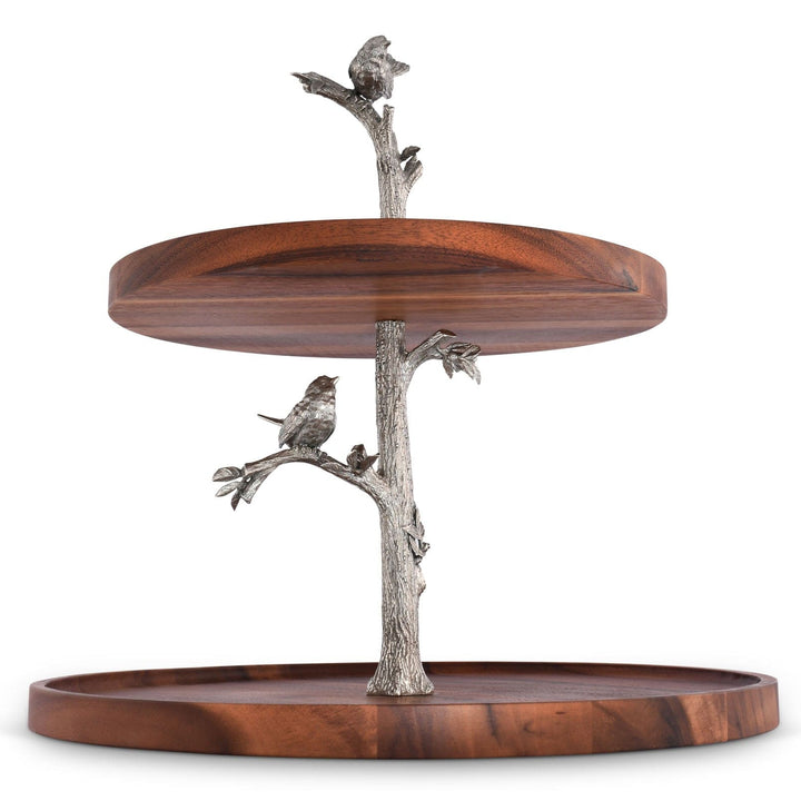 Two-tiered wooden serving tray with metal bird and branch decorations on a white background
