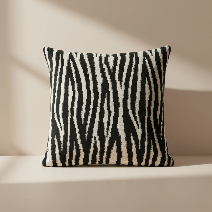 Zebra patterned pillow on a beige background