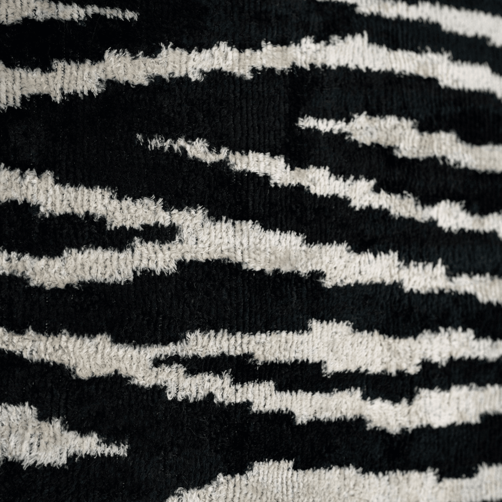 Close-up of black and white striped fabric texture