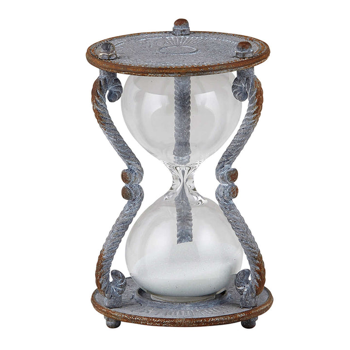 Decorative hourglass with metal frame on a white background