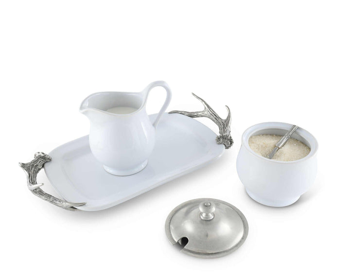 White ceramic set with silver accents on a white background