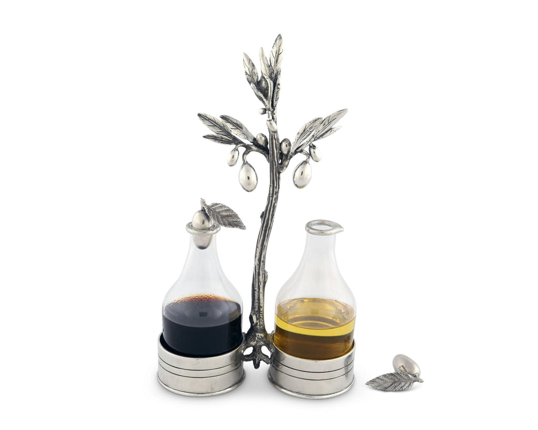 Decorative oil and vinegar set with olive tree design on a white background