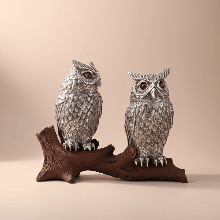 Vintage-Style Pewter Owl Salt and Pepper Shakers sitting on a log