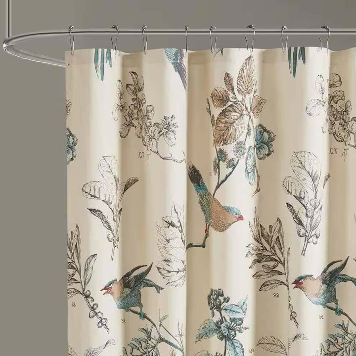 Shower curtain with bird and leaf pattern on a beige background