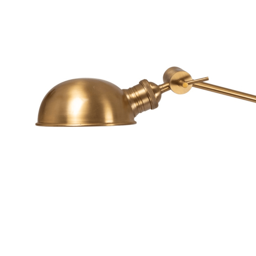 Gold wall-mounted lamp with adjustable arm on a white background