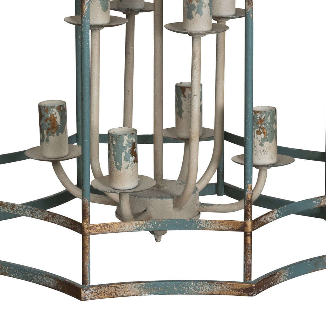 Vintage-style chandelier with distressed metal finish and light holders on a white background