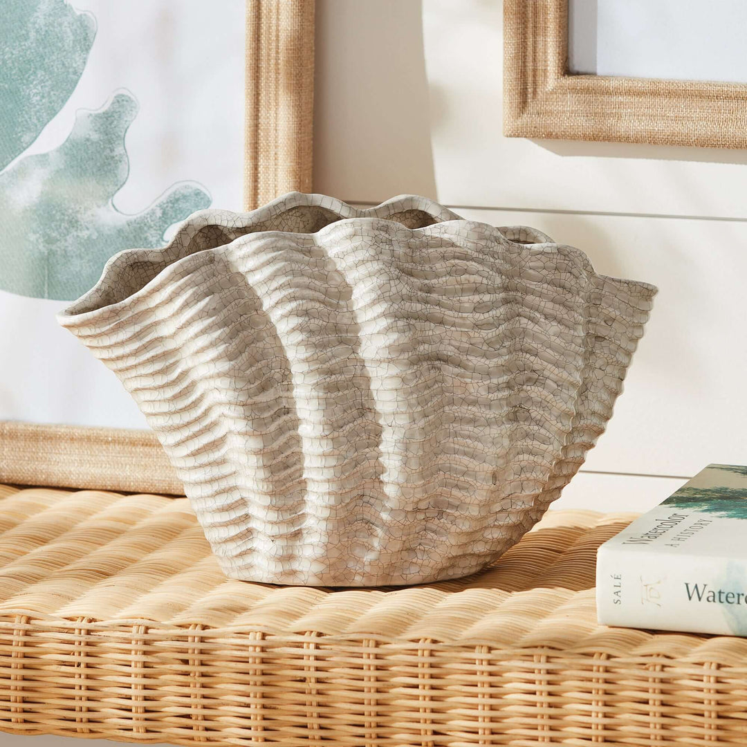 Vintage Coastal Ceramic Shell Vase placed on a rattan tabletop