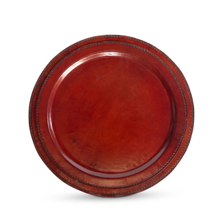 Round leather trays with a reddish-brown finish on a white background