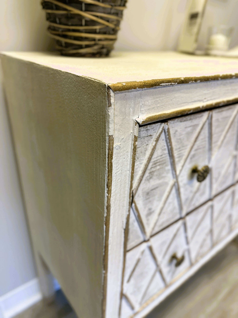 Vintage dresser with diamond pattern and distressed white finish, showcasing rustic charm and functional storage.