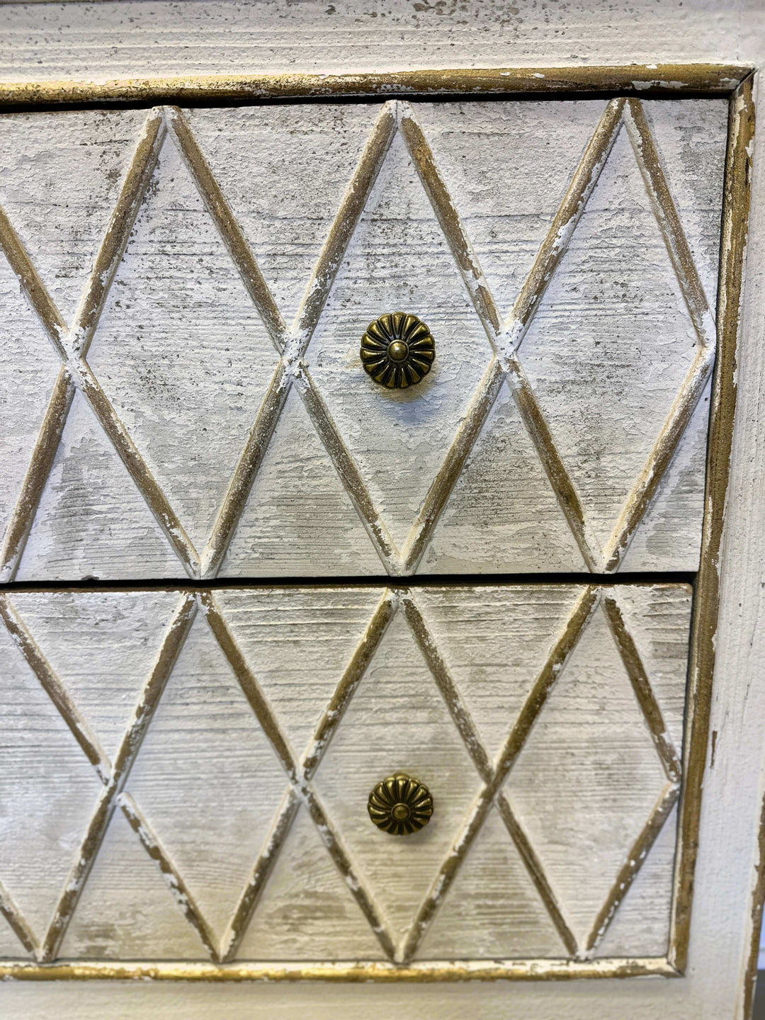 Vintage dresser with distressed white finish and hand-carved diamond pattern drawer fronts.