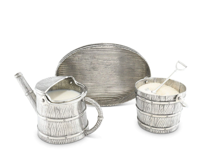 Silver creamer, sugar bowl, and tray set on a white background