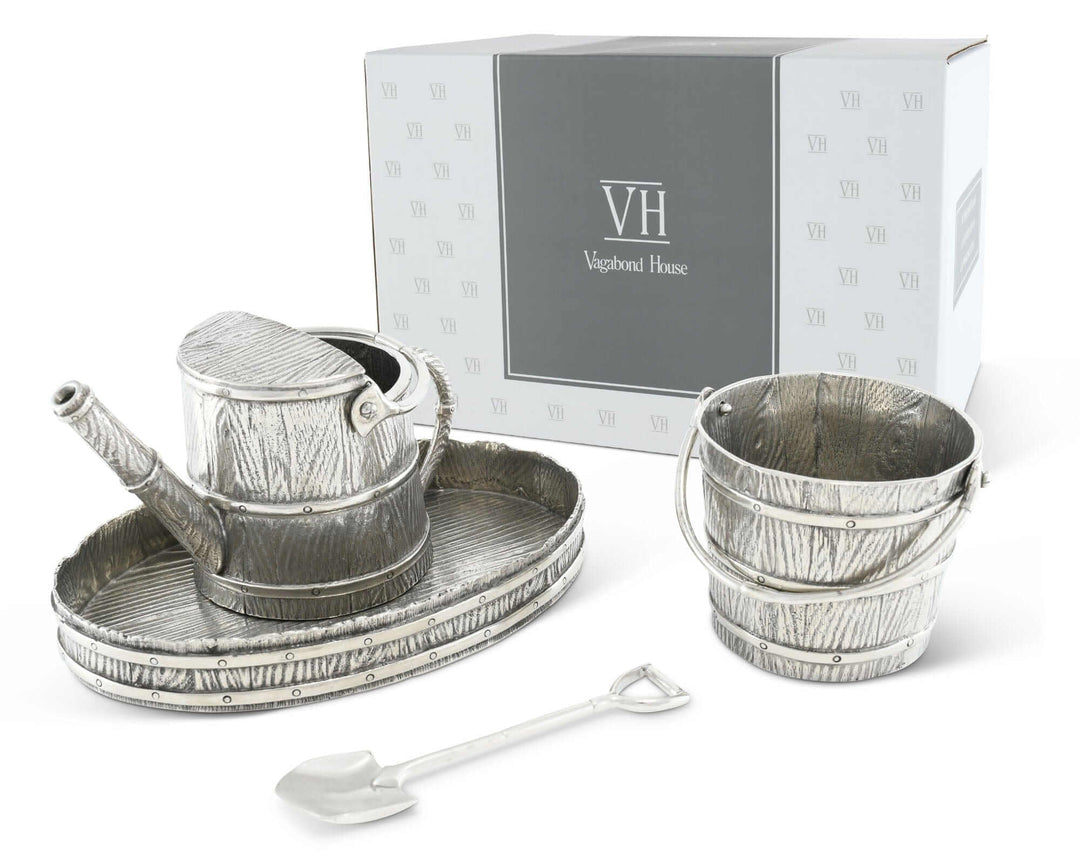 Metallic creamer set with watering can, bucket, and tray in front of a Vagabond House branded box.