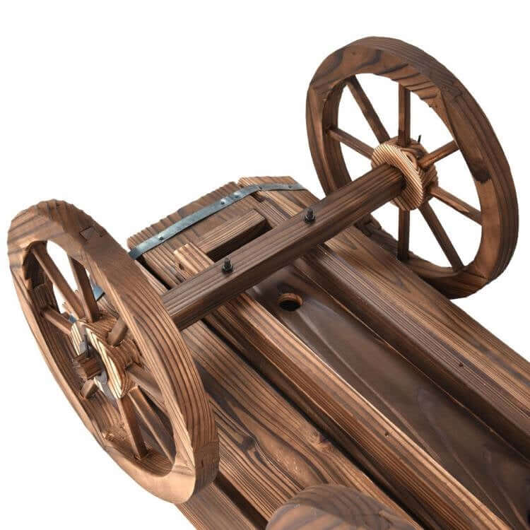Close-up view of the handcrafted Vintage Farmhouse Wooden Wagon Planter's solid fir wood wheels, enhancing garden and patio elegance.