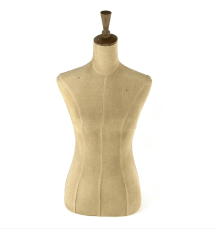 Vintage female dress form mannequin for boutique display or sewing studio decor.