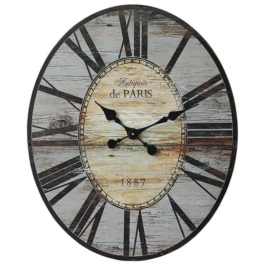 Decorative wall clock with rustic design and 'Antiquite de Paris' text on a white background