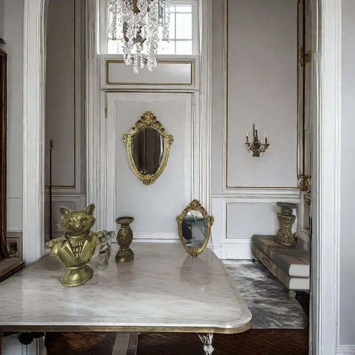 Elegant interior featuring a vintage gold Baroque mirror, crystal chandelier, and ornate decor elements that enhance luxury.