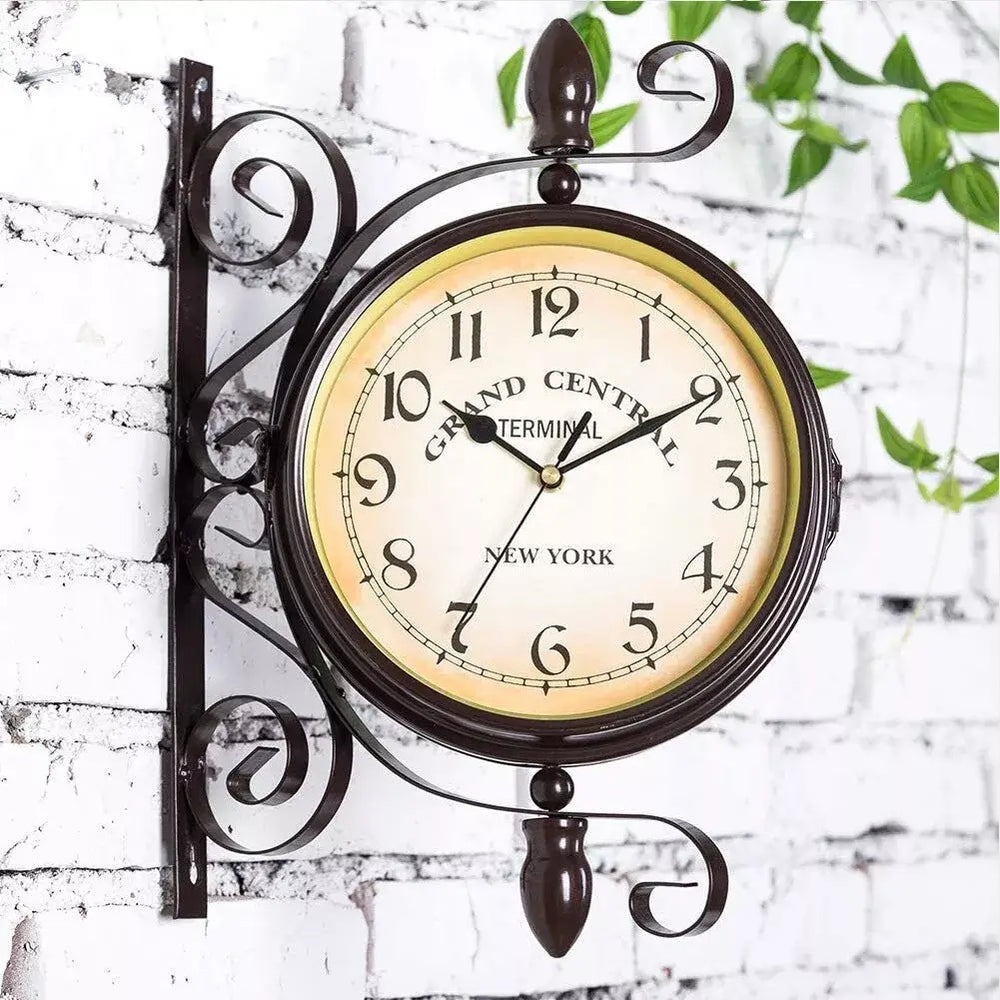 Vintage Grand Central Station double-sided wall clock with antique-style face and iron scroll design.