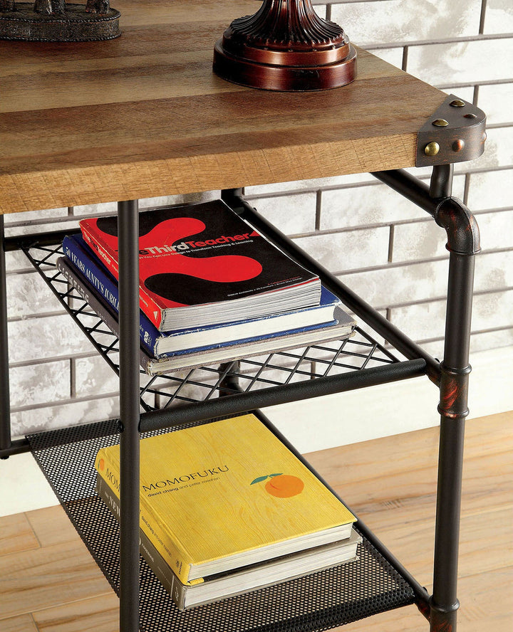 Wooden desk with metal pipe legs holding books on a wooden floor.
