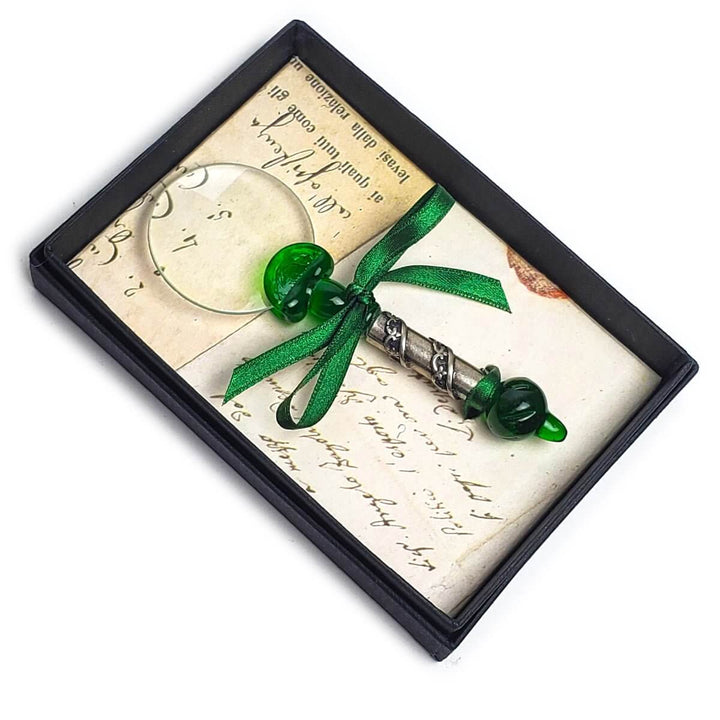 Decorative item with green ribbon and beads on a textured background