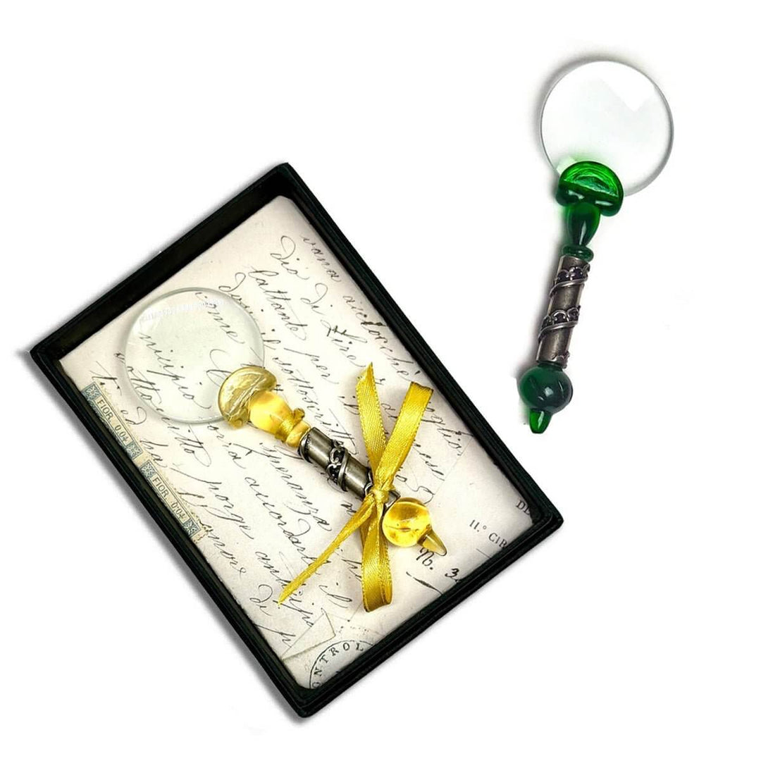 Decorative magnifiers with a green and gold handle in a gift box