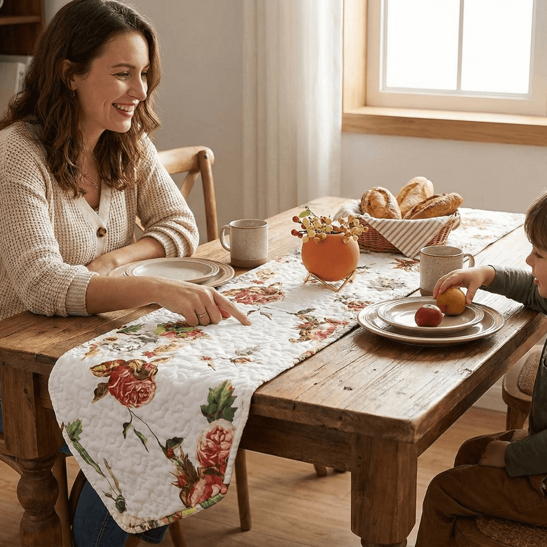 DaDa Bedding Romantic Roses Pink White Lovely Floral Quilted Dining Table Runner (879) on a wooden table in a dining room setting.