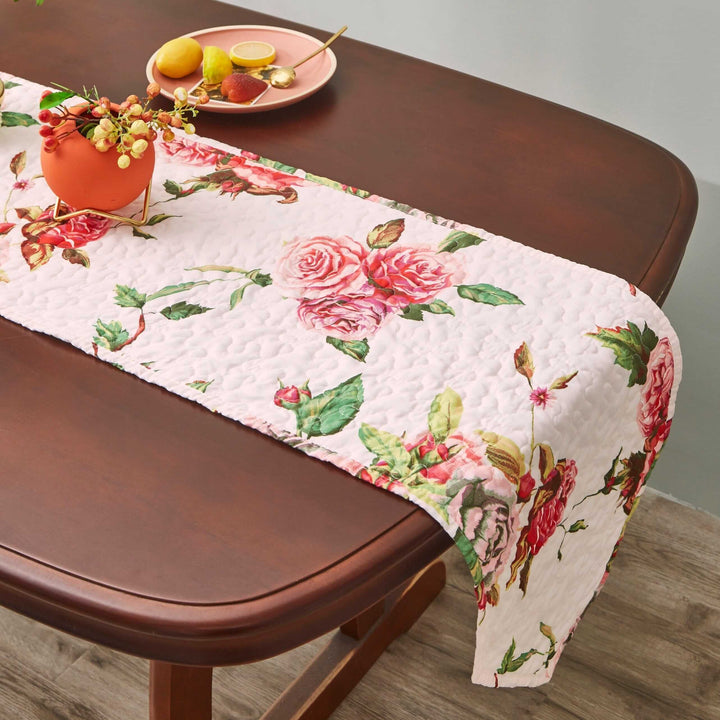 DaDa Bedding Romantic Roses Pink White Lovely Floral Quilted Dining Table Runner (879) displayed on a dining table with decor.