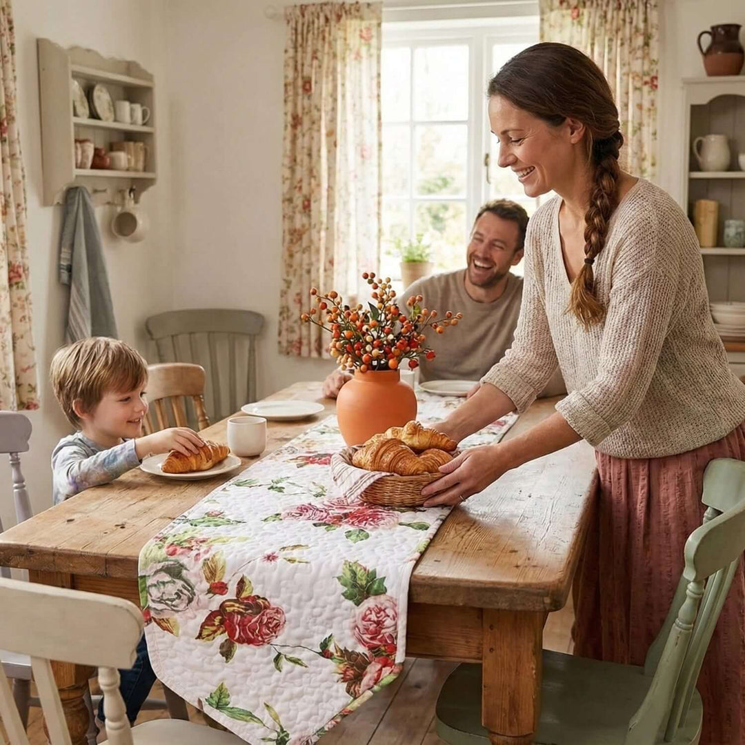 Family enjoying breakfast with DaDa Bedding Romantic Roses Pink White Lovely Floral Quilted Dining Table Runner (879) on wooden table